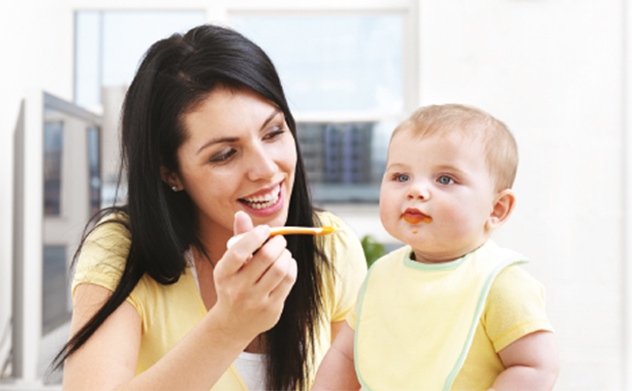 Woman feeding baby